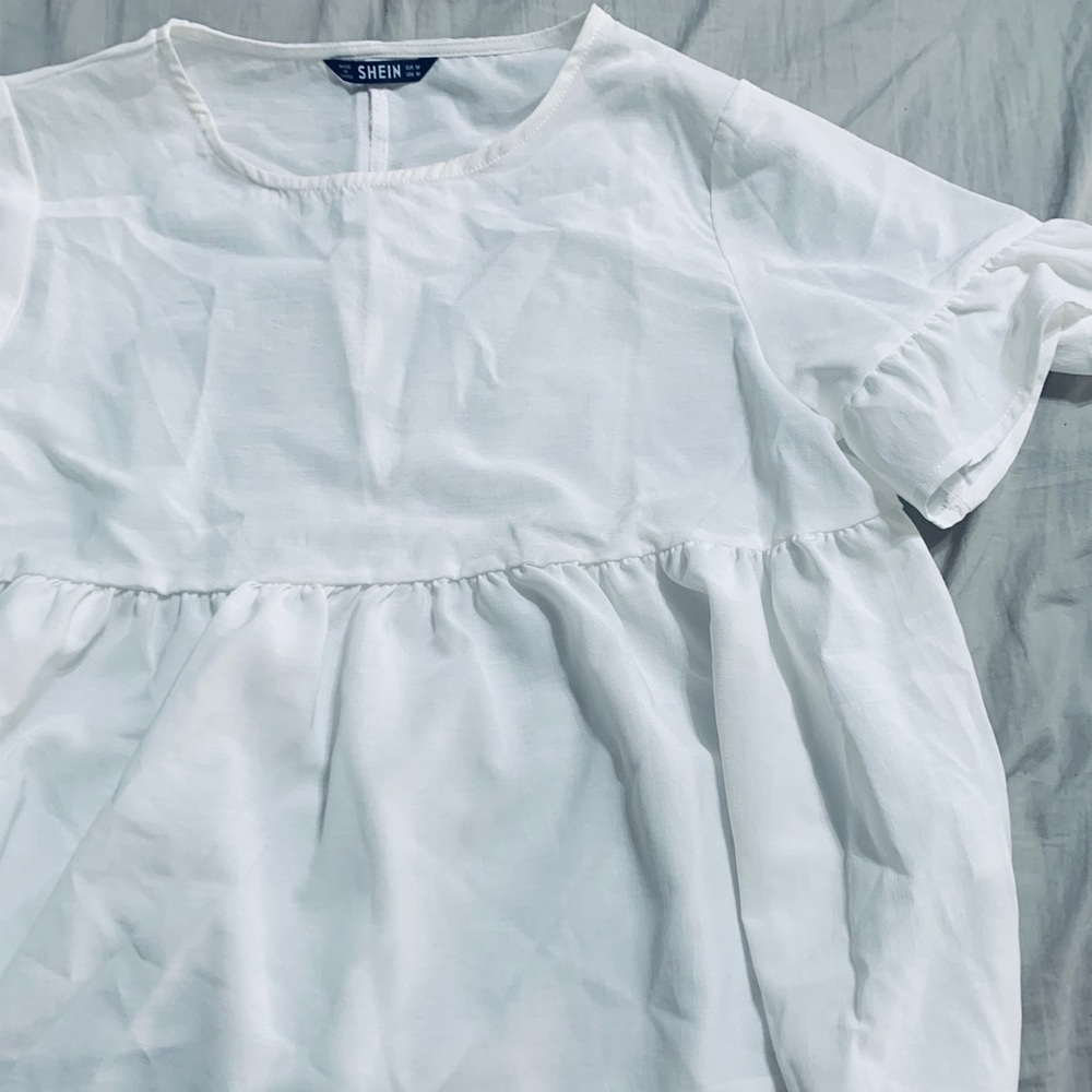 White peplum blouse (makeup stain on the inside)
